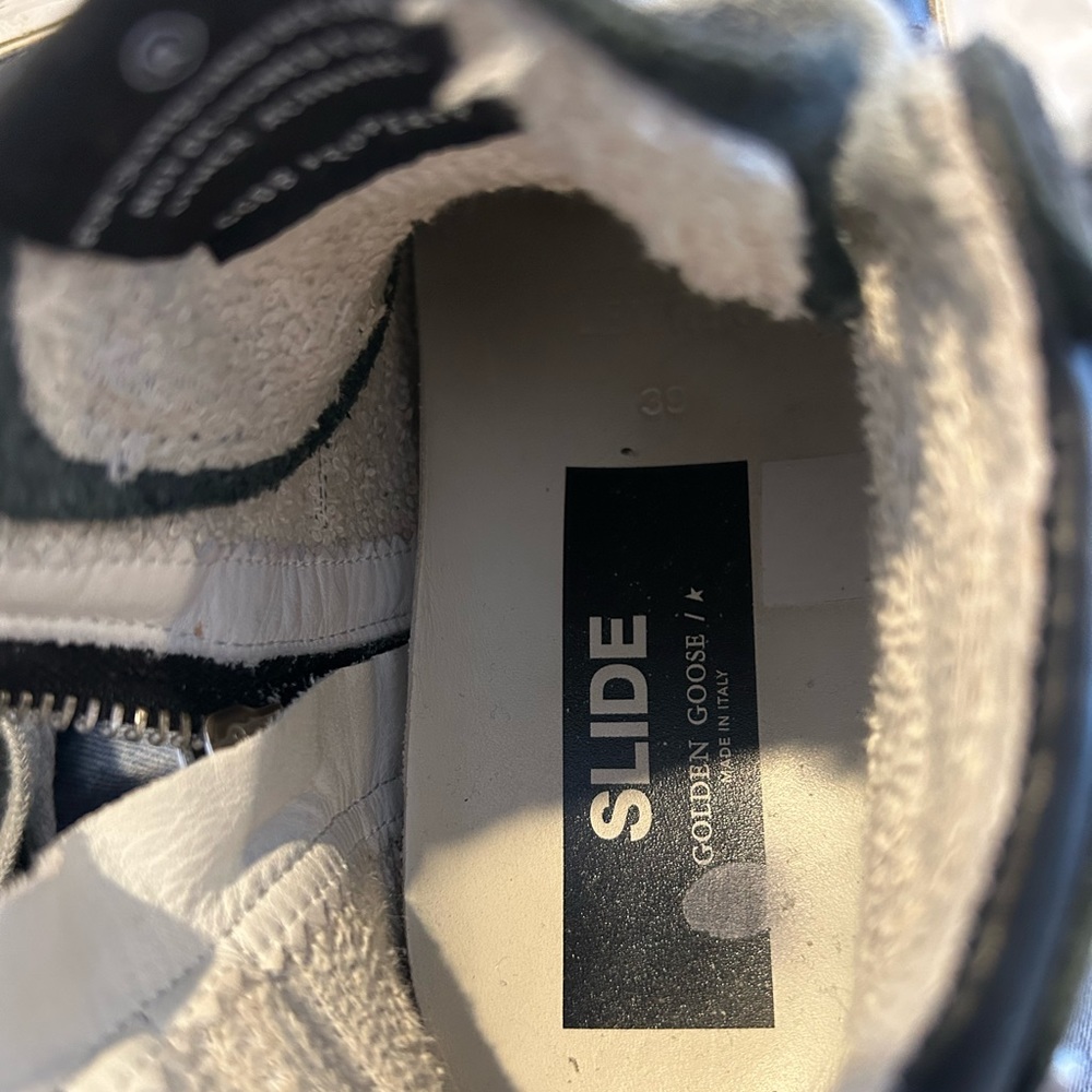 Golden goose. Super stylish with grommets high top sneaker. Decent condition.